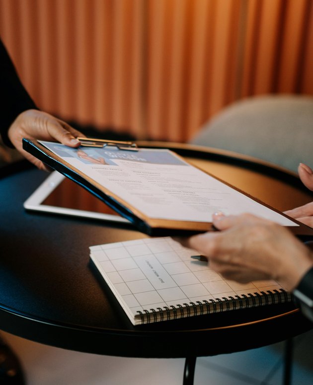 clipboard being passed to another person